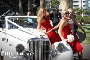 The bridesmaids enjoy the spotlight with the Jaguar
