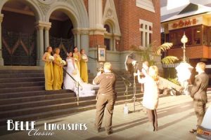 The historic church provides a classic background for wedding photos